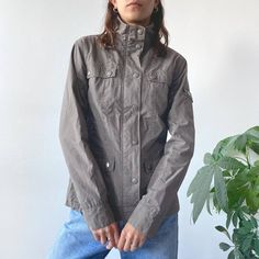 Vintage Y2K 00's 2000's Washed Light Gray Button Up Light Windbreaker Cargo Jacket Cyber Archive Grunge Racing Style Size M condition: 9/10 size: M model is size UK8/EU36/S and is 173 cm tall (5.7ft) the item is preloved/vintage so some signs of natural wear and age might appear we ship from Poland, UK customers DM us for VAT discount! ✨ Y2k Long Sleeve Outerwear With Pockets, Thrift Inspo, Cargo Jacket, Vintage Jacket, Light Jacket, Grey Fashion, Light Gray, Vintage Y2k, Light Grey