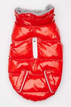 a red dog jacket with silver zippers on the front and back, sitting up against a white background