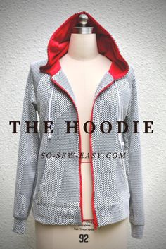 a mannequin wearing a gray jacket with red hoodie on the front and back