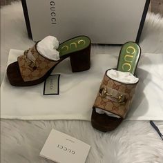 Showcasing Gucci's House Codes, These Gg Mid-Heel Platform Mules Are Made With The House Canvas Monogram And Detailed With A Gold-Tone Horsebit. The Open-Toe Style Has A Square Toe And Brown Suede Trims, Reminiscent Of The '90s. Nostalgia Never Goes Out Of Style. Featuring A Slip-On Style, A Square Toe, An Open Toe, A Monogram Pattern, A Horsebit Detail, A Chunky High Heel And Gold-Tone Hardware. Made In Italy Composition Lining: Leather 100% Sole: Leather 100% Outer: Suede 100%, Canvas 100% Gucci Designer Slip-on Heels, Gucci Luxury Slip-on Heels, Gucci Luxury Heels With Round Toe, Designer Gucci Closed Toe Heels, Designer Gucci Heels With Almond Toe, Designer Brown Slip-on Heels, Designer Heels With Horsebit Detail And Round Toe, Designer Gucci Brown Heels, Luxury Gucci Slip-on Heels