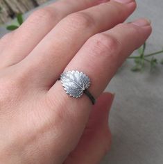 "This wonderful leaf ring is fully handmade of solid sterling silver. Realistic gorgeous minimalist leaf, such an eye cather! If you prefer vintage rustic look, the ring can be darkened for you. The leaf is 1.4 cm wide at the widest part and the ring will be made to your size. Your custom made ring will be prepared and shipped in 7 business days. SIZE: Silver leaf: 1.4 cm Ring width: 1.2 mm MATERIAL: Sterling silver  PLEASE NOTE: Every piece of jewelry ordered from my store is shipped gift wrapp Plant Ring, Coffee Jewelry, Nettle Leaf, Garnet Wedding Rings, Plant Rings, Coffee Bean Earrings, Botanical Ring, Leaves Ring, Woodland Earrings