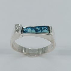 This elegant Turquoise ring has been carefully handcrafted in 925 sterling silver and Diamonds . This impressive ring will make a beautiful birthday/special occasion gift. Once ring has been shipped a tracking number will be provided to you. Free shipping! Ring Measurements: Ring is size 7 1/2 but can be resized at no extra cost and it will be shipped to you in an elegant gift box. Ring weights 2.7 grams Ring Band is: 4.50 mm at widest point and 3.0 mm at smallest point Size: 7 1/2 Materials: Tu Turquoise Sterling Silver Rings With Polished Finish, Blue Turquoise Ring With Polished Finish In Sterling Silver, Hallmarked Turquoise Sterling Silver Ring For Anniversary, Artisan Sterling Silver Turquoise Ring For Anniversary, Anniversary Hallmarked Turquoise Sterling Silver Ring, Blue Turquoise Ring Stamped 925 For Promise, Unique Turquoise Opal Ring Stamped 925, Blue Turquoise Ring With Stamped 925 For Promise, Unique Turquoise Colored Opal Ring Stamped 925