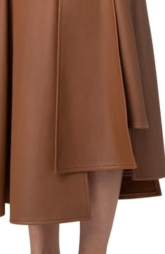 The brand's tailoring expertise is apparent on this asymmetric lambskin-leather skirt with slanting seams always angling toward signature trapezoid shapes. Hidden side-zip closure Hidden side-zip pocket Leather Professional leather clean Made in Switzerland Designer Clothing Brown Leather Flared Skirt, Formal Leather Flared Skirt, Formal Flared Leather Skirt, Modern Leather Pencil Skirt, Formal Brown Leather Skirt, Formal Knee-length Leather Skirt, Modern Leather Skirt For Work, Designer Fitted Leather Skirt, Designer Leather Skirt For Work