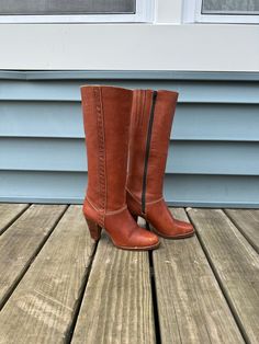 Fantastic 1970's leather boots with wood heels. Made by "Imperial" made in Brazil.  Size 6 Condition is fair/pre-worn as-is. The leather has all-over distress and wear. A simple polish would bring these back to life I think. The soles have cracked across and should be re-soled, but look like they can be worn as-is for awhile.  The heels are 3" high. The shaft is 13" high. Across the ball outside 3" Leather Heeled Boots With Wooden Heel For Fall, Brown Snip Toe Heeled Boots With Stacked Heel, Vintage Fitted Heeled Boots With Leather Sole, Brown Snip Toe Boots With Stacked Heel, Brown Rugged Leather Heeled Boots, Rugged Brown Leather Heeled Boots, Fitted Vintage Heeled Boots With Leather Sole, Vintage Heeled Boots With Leather Sole And Almond Toe, Vintage Heeled Boots With Pointed Toe And Leather Sole