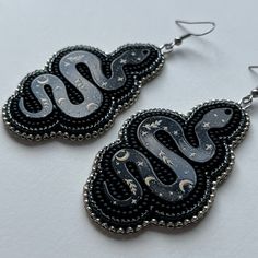 Handmade with high quality size 11 beads & stainless steel hook. Approx. 2.5 inches long & 1.5 inches wide. Unique Silver Jewelry With Black Beads, Adjustable Silver Beaded Earrings With Beaded Chain, Adjustable Silver Beaded Chain Earrings, Handmade Black Snake-shaped Jewelry, Handmade Snake Shape Earrings, Silver Beaded Chain Earrings, Silver Beaded Chain Earrings As Gift, Silver Beaded Chain Earrings For Gift, Silver Spacer Beads Drop Earrings