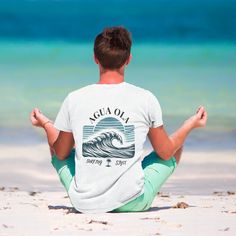 Bring the beach vibes to your everyday look with our super comfy short sleeve surf t-shirt. Crafted from 100% organic cotton, it's soft, breathable, and eco-friendly--perfect for those who care about style and the planet. Whether you're chilling at the beach or just hanging out, this tee is a must-have for anyone who loves comfort and sustainability. It also makes a great gift for any adventure lover! Beach Cotton T-shirt For Warm Weather, Cotton T-shirt For Beach In Warm Weather, Summer Cotton T-shirt For Surfing, Beach Cotton T-shirt With Front Print, Summer Outdoor Activities Crew Neck T-shirt, Summer Outdoor Crew Neck T-shirt, Summer Crew Neck T-shirt For Outdoor Activities, Summer Outdoor Activities Short Sleeve T-shirt, Summer Short Sleeve T-shirt For Outdoor Activities