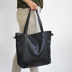 "BIG Shoulder Bag, Shopper Bag for Woman - Tote Bag - Large Crossbody Purse - Handbag with Brass Color Hardware Big SHOPPER LEATHER BAG Leather handbag made of 100% high quality natural leather. Fits all size laptops, 17\" fills the whole bag + room for a couple of books, wallet Brass Color Hardware adds style to the shoulder bag. Inside the shopper bag there is a pocket with zipper - for your keys, lip gloss, iPhone, glasses The bag can be worn on the shoulder or in hand (attachable long strap) Black Tote Bag With Zipper Pocket, Black Bag With Zipper Pocket For Everyday Use, Black Pouch Shoulder Bag For Everyday, Black Everyday Pouch Shoulder Bag, Everyday Black Bag With Zipper Pocket, Black Satchel With Zipper Pocket For Errands, Black Shoulder Bag With Zipper Pocket For Shopping, Black Handheld Hobo Bag For Everyday Use, Black Handheld Shoulder Bag For Everyday Use