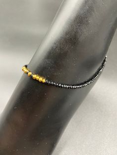 Black crystal with gold  beads single anklet Handmade jewelry  Official Website globusfashions.com 🌸 S H O P . M O R E . S T Y L E S  🌸 https://www.etsy.com/shop/Globusfashions Necklaces -  https://www.etsy.com/shop/Globusfashions?section_id=18712263 Bracelets - https://www.etsy.com/shop/Globusfashions?section_id=18969767 Pendant Sets - https://www.etsy.com/shop/Globusfashions?section_id=18707402 Tikka - https://www.etsy.com/shop/Globusfashions?section_id=20096802 Bangles - https://www.etsy.co Gold Beaded Anklets For Gift, Gold Anklets With Tiny Beads As Gift, Gold Beaded Anklets For Party, Gold Adjustable Anklets With Round Beads, Gold Hand-strung Beaded Bracelets For Party, Adjustable Gold Anklet With Round Beads, Black Bracelets With Tiny Beads For Party, Hand-strung Gold Beaded Bracelets For Parties, Gold Bracelets For Party