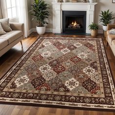 a living room filled with furniture and a fire place in the middle of the room