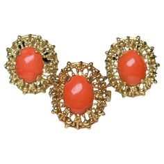 This is a Set of 18K yellow gold Corletto Coral Earrings and Cocktail Ring. It depicts an oval shaped cabochon small Coral mounted in gold prong setting and surrounded by a wreath made of spikes with tiny beads. The ring is signed Italy and 18K in one side and in the other one, Corletto. Tiny Beads, Coral Earrings, How To Make Wreaths, Cocktail Ring, Cocktail Rings, Prong Setting, Vintage Jewelry, Jewelry Rings, Coral