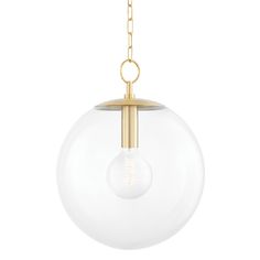 a glass globe light hanging from a gold chain