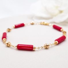 Beautiful handcrafted red coral bracelet with gold hematite brads. Made with high-quality gemstones, this statement bracelet radiates confidence and style, making it the perfect addition to any jewelry collection. With its bold red-gold hues and intricate design, this bracelet is sure to turn heads wherever you go. MATCHING RED CORAL EARRINGS: https://www.etsy.com/au/listing/1746209030/red-coral-earrings-for-women-handmade * Materials: 18k gold plated chain and clasp * Gemstone: Red coral stone Elegant Red Coral Beaded Bracelets For Gift, Gift Jewelry With Hand-strung Red Coral, Hand-strung Red Coral Jewelry For Gifts, Hand-strung Red Coral Jewelry As A Gift, Hand-strung Red Coral Jewelry Gift, Elegant Red Coral Beaded Bracelet Gift, Elegant Natural Stones Beaded Bracelet, Elegant Red Beaded Bracelet With Natural Stones, Gold Red Coral Bracelets As Gift