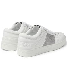 Elevate Your Sneaker Game With These Stylish Jimmy Choo Hawaii Sneakers. The White Sneaker With Silver Glitter Striped Accents And Graphic Hardware At The Lace-Up Closure Add A Touch Of Glamour To This Athletic Shoe. The Sneakers Come With Brand New Inscribed Jimmy Choo Laces And The Brand's Logo Embossed On The Leather Back. Crafted With Buffed Leather Lining, These Sneakers Are Comfortable And Durable. The Rubber Outsole Provides Excellent Grip And Traction. The Shoes Come In Their Original Box With Original Shoe Covers And A Care Booklet. Perfect For Women, These Sneakers Are Available In Size 36. Get Ready To Rock Your Next Athleisure Look With These Jimmy Choo Hawaii Sneakers. These Athletic Shoe, Sneaker Games, Shoe Covers, Jimmy Choo Shoes, Silver Glitter, White Sneaker, Logo Branding, Jimmy Choo, Athleisure