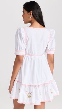 Find ENGLISH FACTORY Embroidered Short Sleeve Dress on Editorialist. Fabric: Mid-weight, non-stretch poplin. Square neckline and short puff sleeves. Floral and border embroidery. Hidden zip at side. Shell: 100% cotton. Lined. Hand wash. Imported, China. Measurements: Measurements from size XS Length: 33in / 84.0cm, from shoulder Summer Mini Dress With Embroidered Hem, Summer Embroidered Hem Mini Dress, White Short Sleeve Mini Dress With Floral Embroidery, Embroidered A-line Mini Dress For Spring, Cotton Embroidered Short Sleeve Mini Dress, Border Embroidery, Pink Brand, Embroidered Shorts, Feminine Aesthetic