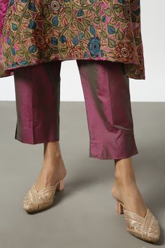 Pink two tone kurta with kalamkari floral applique embroidery and side slits. Paired with pant.
Components: 2
Pattern: Embroidered
Type Of Work: Applique
Neckline: Notched
Sleeve Type: Full
Fabric: Two Tone Silk
Color: Pink
Other Details: 
Side slits
Border detailing
Disclaimer: While the designer strives to recreate every piece as close to what is displayed on the website, there may be subtle variations in color and design. If you have any concerns about the textile, kindly contact the customer Ankle-length Traditional Wear With Zari Work, Designer Chikankari Embroidered Chanderi Pants, Chanderi Pants With Dabka Work, Designer Chanderi Pants With Chikankari Embroidery, Traditional Designer Bottoms With Dabka Work, Traditional Silk Pants With Zari Work, Traditional Bottoms With Dabka Work For Designer Wear, Embroidered Silk Pants, Traditional Fitted Pants For Reception