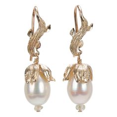 Drop earring.  14kt yellow gold WOS vanilla bean leaf ear wire and bead cap.  White freshwater pearls and Songea sapphires. Vanilla Plant, Gold Drop Necklace, Gold Leaves, White Orchids, Sea Pearls, Shiny Things, Gold Hands, Lovely Jewellery, Modern Earrings