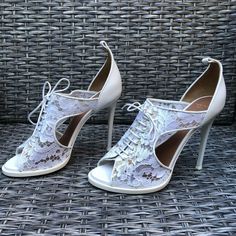 New Givenchy Floral Lace Peep Toe Sandals. Retail $1,390.00. Size: 38.5eu. Color: White. Heel Height: 4.5". Floral Lace Upper With Leather Backing. Peep Toe. Lace Up Style. Leather Lining And Sole. Made In Italy. Condition: New Never Worn Shoes With Minor Marks/Missing Ankle Straps. Box Not Included. Luxury High Heel Lace-up Sandals For Spring, Chic Fitted Open Toe Lace-up Sandals, Elegant Fitted Lace-up Sandals For Summer, Luxury Lace-up Sandals For Spring, Elegant Open Toe Lace-up Sandals With Removable Insole, White Lace Party Sandals, Evening Lace-up Sandals With 4-inch Heel And Round Toe, Spring Lace Heels With Pointed Toe, Heel Strap Lace-up Formal Sandals