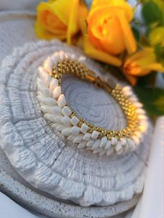 💎Add a touch of elegance to your outfit with this stunning silver and beige beaded bracelet. Each bead is carefully crafted and strung together to create a unique and sophisticated piece that will effortlessly elevate your look.                                                                                                                 💎COLOR: Beige, gold 💎MATERIAL: Japanese beads toxo, long magatama, stainless steel 🔸 The width of the crochet bracelet is 1 centimeter ( 0.39 Inches). 🔸Br Elegant Beaded Bangle Bracelets, Pearl White Bracelets With Gold Beads For Gifts, Elegant Pearl White Beaded Bracelets For Jewelry Making, Unique Hand-strung Gold Beaded Bracelets, Elegant Gold Hand-strung Crystal Bracelet, Elegant Gold Handmade Beaded Bracelets, Elegant Handmade Gold Beaded Bracelets, Gold Beaded Bohemian Pearl Bracelet, Handmade Elegant Pearl White Beaded Bracelets