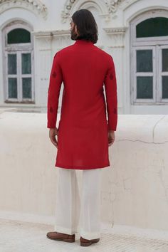 Red full sleeves kurta with damask beaded embroidery. Paired with an ivory trouser. - Aza Fashions Red Straight Kurta Churidar For Formal Occasions, Formal Red Straight Kurta Churidar, Formal Red Churidar With Straight Kurta, Traditional Formal Kurta With Embroidered Sleeves, Unstitched Traditional Wear With Embroidered Sleeves For Wedding, Traditional Bandhgala With Embroidered Sleeves For Eid, Traditional Red Bandhgala For Transitional Season, Festive Sherwani With Embroidered Sleeves For Wedding, Traditional Fitted Red Bandhgala