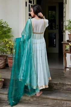 Powder blue hand embroidered anarkali in chanderi with gota and resham dori work. Paired with matching lycra churidar and a contrasting bottle green organza dupatta highlighted with hand embroidery. 
Component: 3
Embroidered
Neckline: Square
Sleeve Length: Full
Fabric: Kurta: Chanderi, Churidar: Lycra, Dupatta: Organza.
Color: Blue
Hand embroidered with gota, resham dori sequins, pearls, sequins and gota lampi - Aza Fashions Square Neck Anarkali, Embroidery Square, Dori Work, Embroidered Anarkali, Blue Embroidery, Organza Dupatta, Embroidered Neckline, Blue Hand, Pernia Pop Up Shop