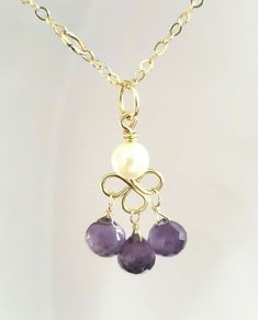 Exquisite Amethyst Briolette and White Freshwater Pearl Chandelier Dangle Pendant        DETAILS         Length: 30mm/ 1 1/4" approx.         Metal: 5mm round wire bail is 14k solid yellow gold, interior diameter is 3.8mm,  wire is high quality 14k gold fill         Handmade         Item weight: 1.36g         Chain not included         STONE DETAILS         Amethyst briolettes are 5x6mm, pearl is 5mm       Will ship safely packaged via USPS First Class. Thank you for your time and shopping by! I Pearl Chandelier, Gold Interior, White Freshwater Pearl, White Pearl, Solid Yellow, Bracelet Patterns, Stone Beads, Pearl White, Freshwater Pearls