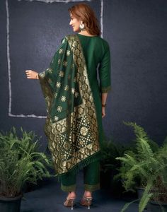 Dark Green Cotton Sequence Straight Kurta Set With Dupatta  Dark Green Cotton Sequence Straight Kurta Set With Dupatta is a glamorous and sparkling ensemble. The intricate sequence work, often arranged in floral motifs or geometric patterns, adds a dazzling shimmer to the kurta. The straight cut provides a modern and streamlined silhouette, while the accompanying dupatta can be styled in various ways to complete the look.  Features Of Dark Green Cotton Sequence Straight Kurta Set With Dupatta  T Elegant Celebration Sets For Navratri, Banarasi Silk Churidar For Festive Occasions, Elegant Art Silk Sets With Motifs, Semi-stitched Celebration Sets With Motifs, Designer Gold Sets With Motifs, Festive Banarasi Silk Sets, Elegant Banarasi Silk Festive Sets, Elegant Banarasi Silk Sets For Festive Season, Bollywood Style Festive Palazzo Set With Motifs