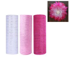 three rolls of pink and white mesh next to each other with a flower in the middle