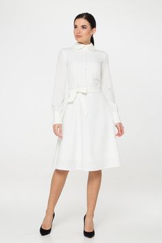 "A collared midi dress featuring a button front closure (imitation), fabric belt, and a fit and flare silhouette. - fit and flare silhouette - high rounded collar - knee length (midi) - long sleeves with cuffs - fabric belt - covered button front decor - concealed zipper closure - lined bodice and skirt - color: white Fiber: 60% viscose, 35% polyester, 5 % elastane, Lining - 95 % viscose, 5% elastane. For size S:dress length- 40,0 \" (102 cm), sleeve length 24,21\" (61,5 cm) Our model wears size Classic White A-line Shirt Dress, Chic A-line Long Sleeve Wedding Dress, Classic A-line Midi Dress For Wedding, Chic White A-line Long Sleeve Dress, Elegant A-line Vintage Dress For Daywear, Elegant Vintage Midi-length Dress For Spring, Elegant Belted Shirt Dress For Party, Elegant Vintage Midi Dress For Spring, Chic Long Sleeve Dress For Fall Wedding