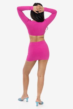 This sexy mini skirt is made of our premium heavyweight cotton spandex, with ample compression and stretch for a flattering look. Features a mid-waist fit with ruching at the center and a v-cut front. Try pairing with our 8387GD Ruched Front Long Sleeve Top for a matching set, or pair over a contrasting bodysuit for a night out. Runs true to size. Made in Los Angeles, Calif. Our experienced sewers earn up to $25 an hour and no less than $16; additionally workers have healthcare benefits for less Spring Fitted Seamless Shorts, Stretch Mini Skirt With Built-in Shorts For Night Out, Stretch Cotton Mini Skirt, Trendy Fitted Crop Top With Built-in Shorts, Fitted Elastane Shorts For Night Out, Stretch Cotton Mini Skirt For Night Out, Fitted Cotton Mini Skirt With Built-in Shorts, Fitted Ruched Crop Top, Flirty Stretch Skort In Solid Color