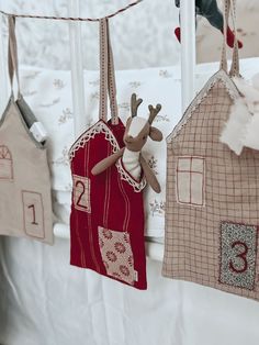 three little houses hanging from the clothes line