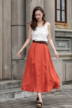 "DETAIL * 100% Linen * Two side pockets * Back elastic waist * Button down skirt * Button front skirt * Below Knee Length * A Line skirt, Midi skirt * Perfect for Spring, Summer and Autumn * Wash by hand or machine with cold water * Model's belt is not sale item * The model is 170 cm (5′ 7″) tall with a 80 cm (31.5\") bust, 66 cm (26\") waist. She is wearing in size XS. CUSTOM MADE SERVICE If you * Change other color * Can't find your size in our size Chart * Change the Style * Change the length Summer A-line Skirt With Button Closure, Buttoned Maxi Skirt For Spring, Spring Buttoned Maxi Skirt, Knee-length Summer Skirt With Button Closure, Summer Knee-length Skirt With Button Closure, Casual Orange Relaxed Fit Maxi Skirt, Casual Midi Length Pencil Skirt, Spring Midi Skirt With Button Closure, Summer Midi Skirt With Button Closure