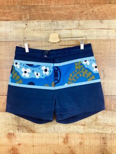 Vintage 1960s Surfer Shorts button closure at waist dark navy blue in color tropical floral print cotton material back pockets builtin underpants by Jantzen great vintage condition appx size - XL 38 waist 15 length all sales final Retro Vacation Bottoms With Pockets, Retro Bottoms With Pockets For Vacation, Retro Cotton Shorts For Beach Season, Vintage Floral Print Bottoms For Vacation, Vintage Blue Floral Print Bottoms, Blue Floral Print Cotton Shorts, Vintage Cotton Beach Bottoms, Retro Cotton Bottoms For Beach Season, Vintage Bottoms For Beach Season Vacation