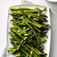 asparagus on a white plate with a fork