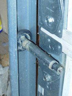 an open door with the handle on it's latch and some wires attached to it