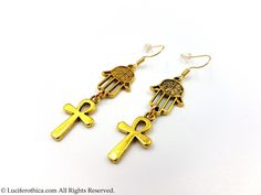 Mini Ankh Earrings - Ankh Symbols (2cmx1.3cm) - Hamsa Symbols. - 4cm total earrings length. - Earhooks in various material : Chose from dropdown box. - Gold colour. - Handmade. - Comes in a pair. Fast Worldwide Shipping More jewellery, accesoires, altar equipment and much more can be found at www.luciferothica.com © Luciferothica.com All Rights Reserved. Gold Ankh Shaped Metal Jewelry, Adjustable Brass Cross Jewelry, Adjustable Brass Cross-shaped Jewelry, Symbolic Nickel-free Plug Earrings As Gift, Symbolic Nickel-free Plug Earrings For Gifts, Gold Ankh Metal Jewelry, Adjustable Gold Plug Earrings With Ear Wire, Handmade Gothic Plug Earrings As Gift, Gothic Gold Brass Jewelry