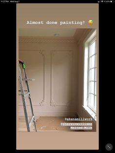 an empty room with a ladder in it