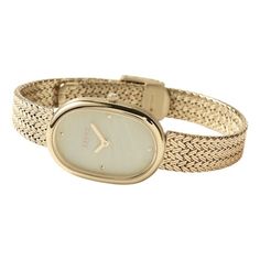 A delicately tapered watch with a mother-of-pearl dial Elegant White Watch With Bracelet Strap, Elegant White Watches With Bracelet Strap, Elegant Oval Watches For Evening, Elegant Anniversary Watch With Bracelet Strap, Elegant Oval White Gold Watch, Chic Formal Watch With Metal Dial, Chic Formal Watches With Metal Dial, Chic Formal Watches With Round Dial, Elegant White Watches With Metal Dial