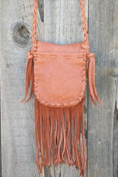 "This fringed leather purse is made to order. It is made of soft, strong leather and measures 7\" tall x 6\" wide x 1 1/2\" deep. It features a inside pocket , one outside on the back, an antler button for closure and a 48\" braided strap. We can make this bag in a variety of colors in soft tanned cowhide leather ( see the last photo ). Just leave a note at check out or contact us... This item is MADE TO ORDER. You will not receive the piece you see in the photos, we will make one similar for yo Rectangular Leather Shoulder Bag With Fringe, Leather Fringe Pouch Bag, Leather Fringe Satchel Shoulder Bag, Everyday Leather Fringe Satchel, Leather Fringe Satchel For Everyday, Festival Soft Leather Crossbody Shoulder Bag, Leather Shoulder Bag With Fringe For Daily Use, Leather Pouch Shoulder Bag For Festivals, Leather Satchel With Tassels As Shoulder Bag