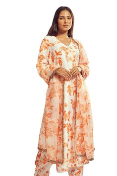 Burnt orange bell sleeves A-line kurta with all over floral print. Paired with a matching printed pant and a dupatta with gold trim lace detailing on the borders. - Aza Fashions Long Sleeve Orange Kaftan For Spring, Orange Long Sleeve Kaftan For Spring, Orange Long Sleeve Spring Kaftan, Traditional Long Sleeve Orange Kaftan, Orange Palazzo Set With Straight Kurta For Designer Wear, Orange Straight Kurta Palazzo Set For Designer Wear, Orange Bohemian Set For Eid, Bohemian Orange Sets For Eid, Bohemian Orange Set For Eid