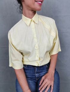 "Vintage blouse for women size S | Light yellow blouse with front pleats. Very cute blouse, great for summer. Composition: 65% cotton, 35% polyester. Size on tag: 36. Measurements of the vintage blouse for women lying flat: Armpit to armpit: 50 cm | 19.7\" Length: 60 cm | 23.6\" Shoulders: 40 cm | 15\" In excellent vintage condition. My shop is dedicated to vintage blouses exclusively, so have a look for more beautiful options: https://etsy.me/2PovJic" Cheap Vintage Yellow Shirt, Cheap Yellow Semi-stitched Blouse, Vintage Blouses, Vintage Blouse, Yellow Blouse, Cute Blouses, Blouse For Women, Blouse Vintage, Light Yellow