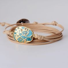 Charm your Bohemian Style with a Beautiful Turquoise GemStone Rope Bracelet  This Hand Made Rope wrap Bracelet is specially made for Bohemian stylish queens who are looking for a  Charming Style inspired by the Magical Nature  ✔ This splendid Boho Wrap Bracelet is carefully handmade with  Natural Turquoise Gem Stones  It features a Shining Mix of Contrasted Gold and Turquoise Colors Adding the  Charming Natural Inspired Beauty  with its unique Magic to your style. ✔This Turquoise Wrap Bracelet, Turquoise Gem, Magical Nature, Treasure Jewelry, Healing Gemstone Bracelets, Boho Wrap Bracelet, Turquoise Charm, Amazonite Bracelet, Rope Wrapped