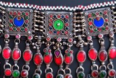 This colorful Afghan choker necklace was handcrafted during the mid-1900's for the nomadic Kuchi tribe of Central Asia. It is vintage tribal jewelry - not a new reproduction. MEASUREMENTS: (1 inch = 2.54 cm) Length = Adjustable with ties Width across beaded portion of neckband = 12 inches (not including ties) Front Drop = 5 inches (distance between upper/lower edges at center front) Weight = 10.1 oz Shipping weight = 1 pound TM Image library 12-23-2019 The wide flexible neckband has a large circ Traditional Ceremonial Necklaces, Traditional One Of A Kind Necklaces For Ceremonial Occasions, Traditional One-of-a-kind Necklace For Festival, Handmade Bohemian Necklaces For Traditional Ceremonies, Traditional One-of-a-kind Necklaces For Ceremonial Occasions, Bohemian Red Necklaces For Traditional Ceremonies, Red Bohemian Necklaces For Traditional Ceremonies, Vintage Ceremonial Choker Necklace, Vintage Necklaces For Festivals