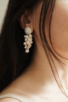 The Anita Berisha Mini Mermaid Earrings were inspired by earths layers, oceans, rocks, and minerals, a tribute to our precious planet. The Mermaid Earrings are meticulously handcrafted using seashells and freshwater pearls, using 24K gold-plated posts. Each Earring set is unique due to the organic nature of the pearls. Seashells Freshwater Pearls 24K Gold Plated Posts The Seashell Earring: approx. 2.5 inches long The Stud Pearl Earring: approx. 2 inches long Each earring set is unique due to the Seashell Earrings, Organic Nature, Mermaid Earrings, Slow Fashion Brands, Pearl Earring, Freshwater Cultured Pearls, Pearl Stud Earrings, Handmade Design, Slow Fashion