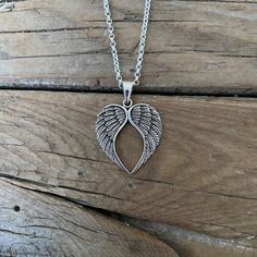 "Angel wing heart necklace....1 1/2\" tall with bail by 1 1/16\" wide at the widest spot, cast and antiqued in sterling silver 925...great detail, the chain is 20\" long also in sterling silver 925 with a lobster catch" Silver Winged Engraved Jewelry, Silver Heart Pendant With Large Pendant, Silver Large Heart Pendant Jewelry, Silver Heart Pendant Jewelry With Large Pendant, Antique Silver Sterling Silver Necklace With Large Pendant, Antique Silver Necklace With Large Sterling Silver Pendant, Engraved Winged Sterling Silver Jewelry, Nickel-free Silver Winged Jewelry, Antique Silver Heart Jewelry With Oxidized Finish