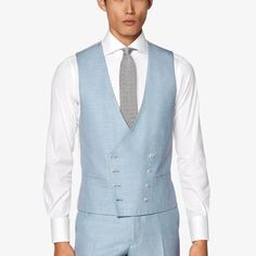 This double-breasted light blue waistcoat is tailored slim with a rear adjustment strap from a wool-silk-linen blend by Italy's E.Thomas mill. Elegant Slim Fit Vest For Spring, Spring Tailored Sleeveless Suit, Elegant Blue Office Vest, Fitted Blue Double-breasted Suit, Single Breasted Business Vest For Spring, Fitted Linen Double Breasted Suit, Fitted Linen Double-breasted Suit, Spring Formal Linen Vest, Tailored Formal Vest For Summer