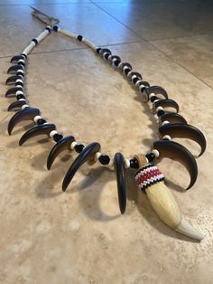 "This item is Proudly Native American Made and will come with a Certificate of Authenticity stating my enrollment and clan information. I am also a member of the Native American Arts & Craft Association. Portions of each sale go to my local community, tribe etc. This is made with a high quality resin black Bear claws and teeth. These are the best reproductions I can find. Sadly Reproductions are actually MORE expensive than my real claws and teeth. claws and teeth. This is the necklace you w Xr Aesthetic, Bear Claw Necklace, Indian Clubs, Aboriginal Culture, Claw Necklace, Bear Claw, Liminal Space, Native American Crafts, Bear Claws