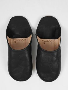 Moroccan Babouche Slippers - a classic bespoke pair of soft leather slippers handmade using the traditional techniques of skilled leather artisans. These leather slippers are a chic home accessory and the perfect gift for her, with free shipping. - 100% leather - for indoor use only - Ethically Handmade in Morocco - Free US Shipping Leather Closed Toe Indoor Slippers, Black Leather Indoor Slippers, Black Leather Slippers With Leather Lining, Elegant Black Leather Slippers, Leather Slip-on Mules For Indoor, Comfortable Black Slippers With Leather Sole, Black Leather Slippers With Leather Sole, Leather Mules For Indoor Use With Round Toe, Comfortable Black Leather Slippers