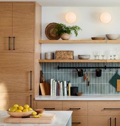 the kitchen is clean and ready for us to use it's shelves are made of wood