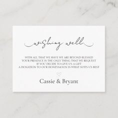 the wedding well card is displayed on a marble surface