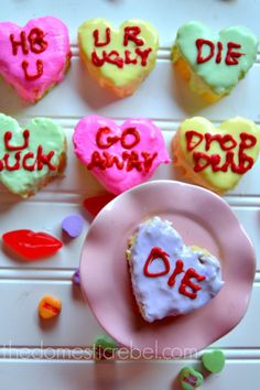 heart shaped cupcakes with the words i love you written on them in different colors